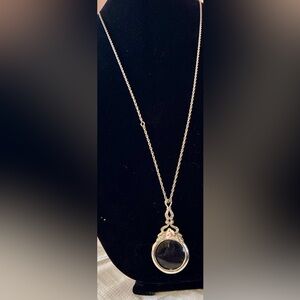 Vintage “Avon” Magnifying Glass Pendant with Rose Motif on A Silver Tone Chain